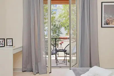a room with a balcony with sliding glass doors at A Casa di Domenico in Rome