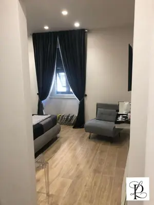 a living room with a couch and a window at Pinciano 1stfloor in Rome
