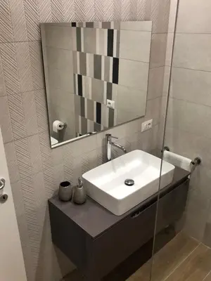 a bathroom with a sink and a mirror at Pinciano 1stfloor in Rome