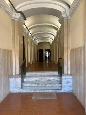 an empty hallway with stairs in a building at A casa di Ala in Rome