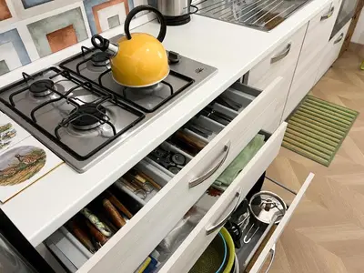 a kitchen with a stove with a yellow pot on it at A casa di Ala in Rome