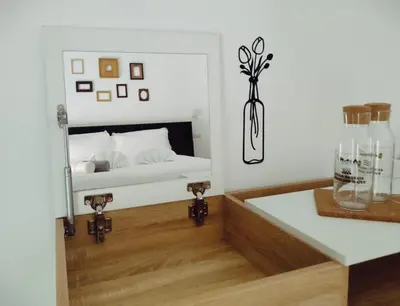 a bedroom with a bed and a vase on a table at Bagnera51 in Rome