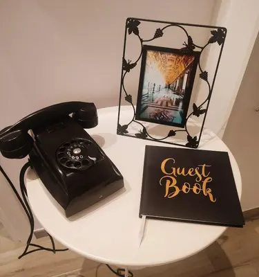 a guest book and a phone on a table at Bagnera51 in Rome