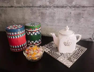 a table with a tea pot and a bowl of candy at Bagnera51 in Rome