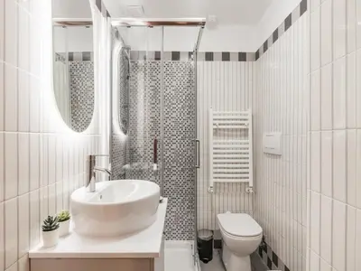 a white bathroom with a sink and a toilet at The Best Rent - Three-Bedroom apartment in Manzoni district in Rome