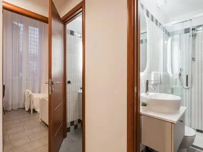a bathroom with a sink and a toilet at The Best Rent - Three-Bedroom apartment in Manzoni district in Rome