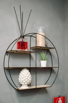 a glass shelf with a vase and other items on it at Maison Macao - Golden Keys Collection in Rome