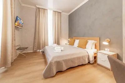 a hotel room with a bed and a window at Maison Macao - Golden Keys Collection in Rome