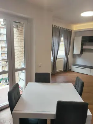 a dining room with a white table and chairs at Il covo dei Briganti in Rome