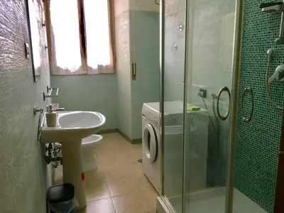 a bathroom with a toilet and a sink and a shower at San Giovanni Apartment in Rome