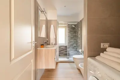 a bathroom with a toilet and a sink at Marisa Home in Rome