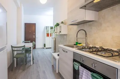 a kitchen with a sink and a stove top oven at Garden House by BuddyRent in Rome