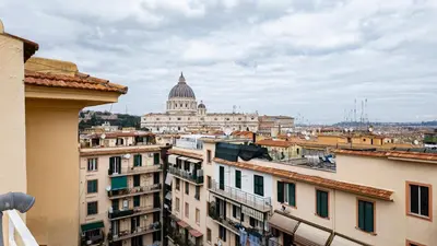 a view of theatican from the roofs of buildings at Vatican Bells with Balcony View of St Peters Dome Two Bedrooms Two Bathrooms in Rome