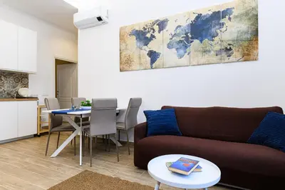 a bedroom with a bed and a window at Vatican Bells with Balcony View of St Peters Dome Two Bedrooms Two Bathrooms in Rome