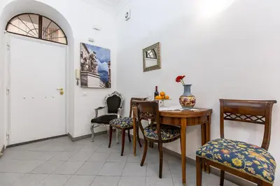 a dining room with a table and chairs at Gianicolo Holiday House in Rome