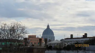 a view of a building with a dome in the background at Vatican Apartment in Rome