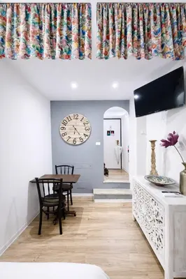 a small kitchen with a sink and a microwave at Navona cozy Loft in Rome