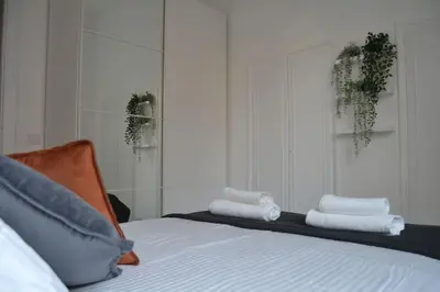 a bedroom with a bed with towels on it at Maison Coco' in Rome in Rome