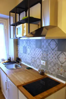 a kitchen with a sink and a counter top at Monolocale Urban House Marconi in Rome