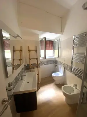 a bathroom with a sink and a toilet at Monolocale Urban House Marconi in Rome