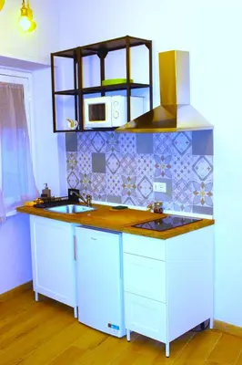 a kitchen with a sink and a microwave at Monolocale Urban House Marconi in Rome