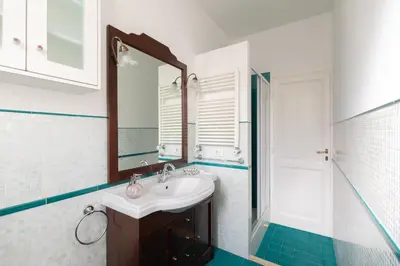 a bathroom with a sink and a mirror at G & G Maisonette Testaccio in Rome