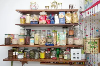 a shelf filled with lots of jars of food at Vintage in Trastevere in Rome