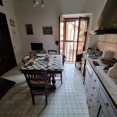 a kitchen with a table and a counter top at Casa Nicoletta in Rome