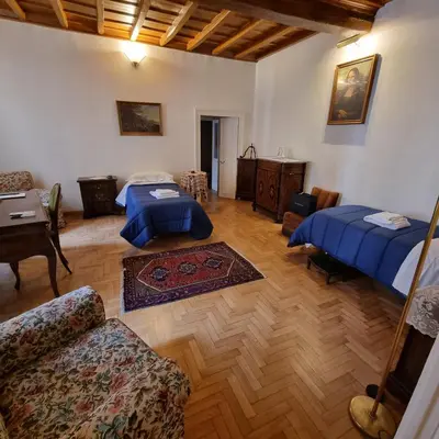 a living room with two beds and a couch at Casa Nicoletta in Rome