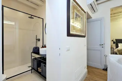 a bathroom with a shower and a sink at Luxury Charme between Pantheon and Spanish Steps in Rome