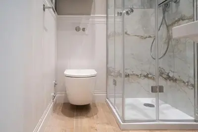 a white bathroom with a shower and a toilet at ROME City Center Apartment II in Rome
