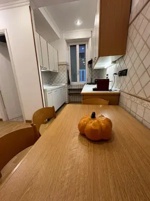 a pumpkin sitting on top of a table in a kitchen at San Pietro city center close to the subway in Rome