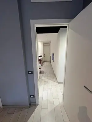 an empty hallway with a room with a table in it at Cuore di Testaccio Apartment 2 in Rome