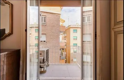 a sliding glass door with a view of a balcony at Domus Testaccio in Rome