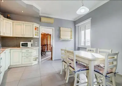 a kitchen with a table and chairs in a room at Domus Testaccio in Rome