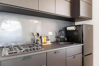 a kitchen with a stove and a sink at Your Cozy Home in Rome- Gemelli- close to downtown in Rome