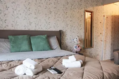 a bed with towels on it in a room at Villa Bonelli Dreams in Rome in Rome