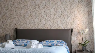 a bedroom with a bed with towels on it at Villa Bonelli Dreams in Rome in Rome