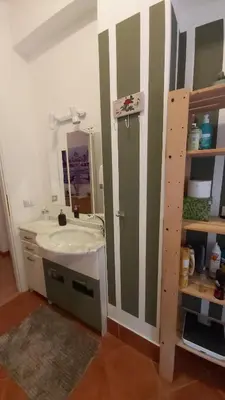 a bathroom with a sink and a mirror at CORNELIUS in Rome