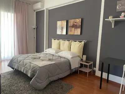 a bedroom with a large bed in a room at CORNELIUS in Rome