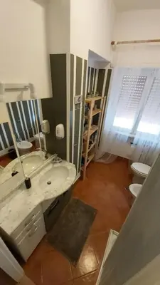 a bathroom with a sink and a toilet at CORNELIUS in Rome