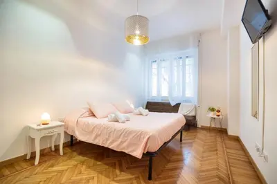a bedroom with a bed and a tv in it at Appartamento via Milizia in Rome