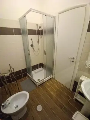 a bathroom with a shower and a toilet and a sink at Jack's House - Tourist Rentals - in Rome