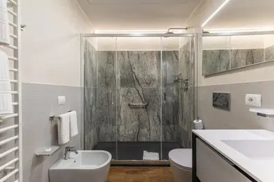 a bathroom with a shower and a toilet and a sink at MyItalyHome Roma in Rome