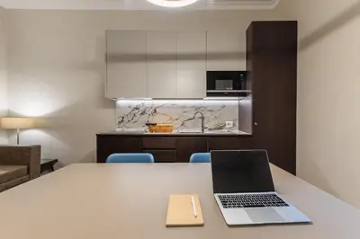 a laptop sitting on a table in a kitchen at MyItalyHome Roma in Rome