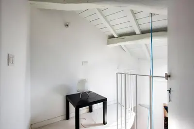 a room with a black table and a ceiling at Imperial Forums Apartment IN Campitelli in Rome