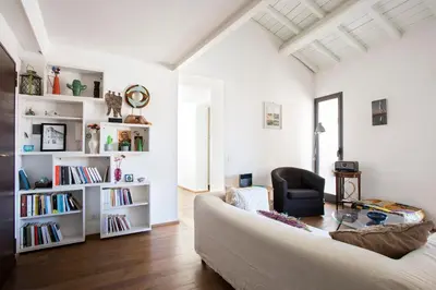 a living room with a couch and a chair at Imperial Forums Apartment IN Campitelli in Rome