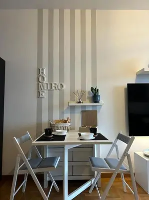 a dining room with a table and chairs at Miro Home in Rome