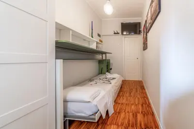 a small room with a bed and a closet at Domus Rea - Vaticano - Metro Baldo degli Ubaldi in Rome