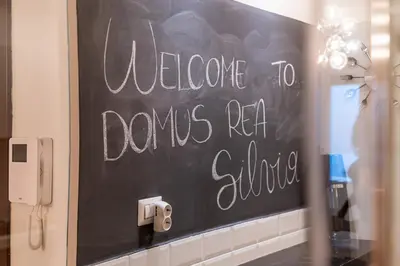 a chalkboard with the words welcome to davis realillian at Domus Rea - Vaticano - Metro Baldo degli Ubaldi in Rome